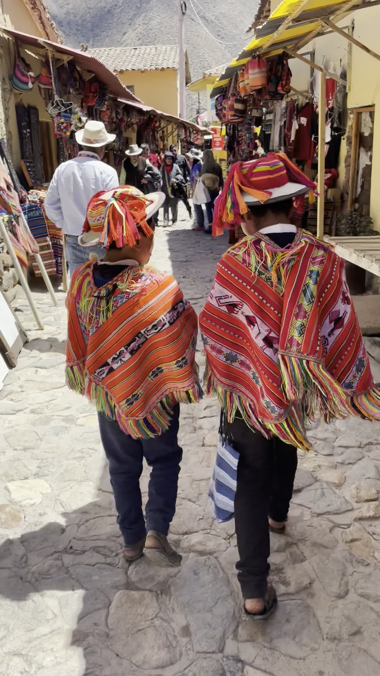 Locals in traditional ponchos welcoming our group