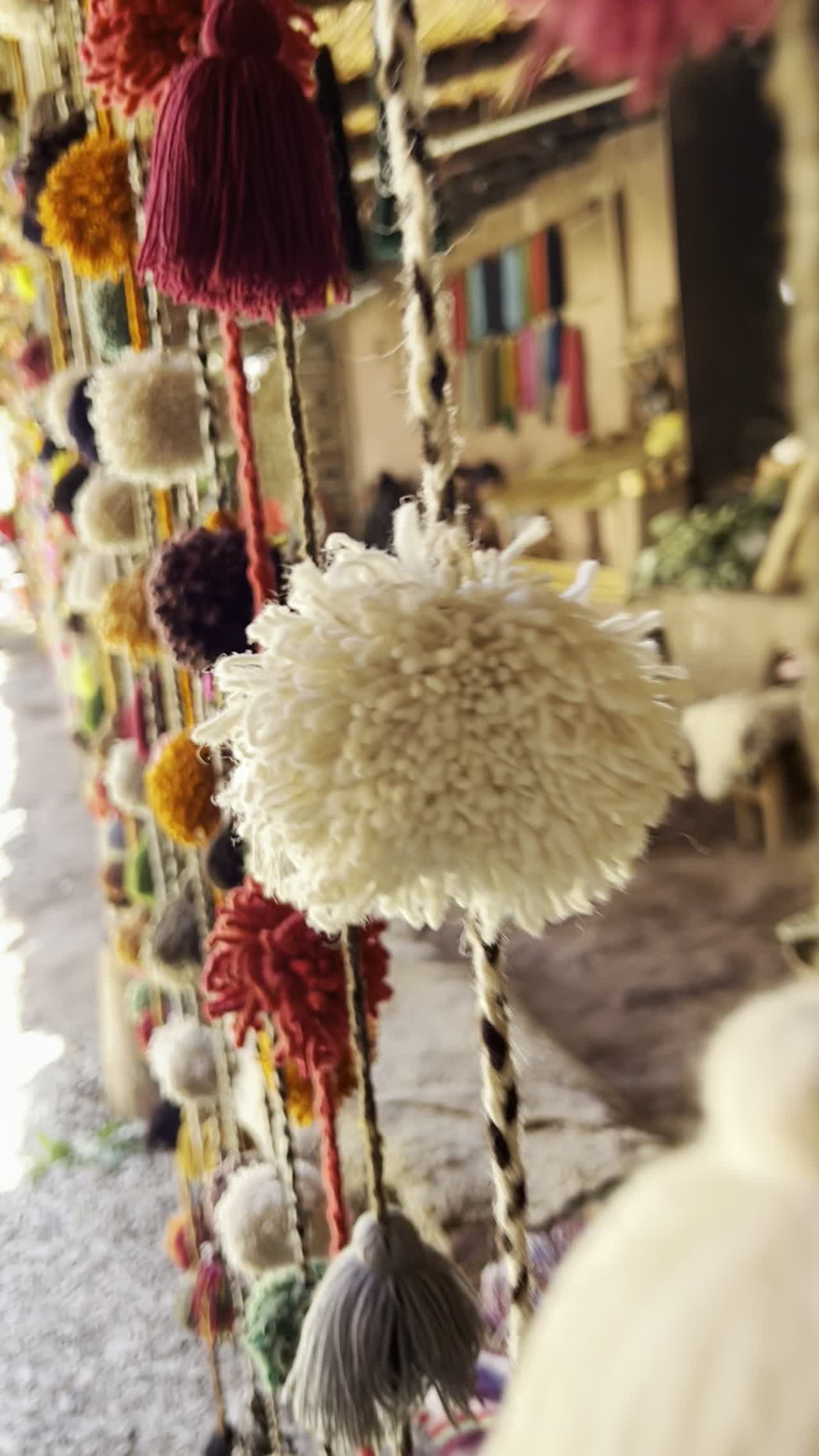 Handwoven textiles and tassels at a local artisan market