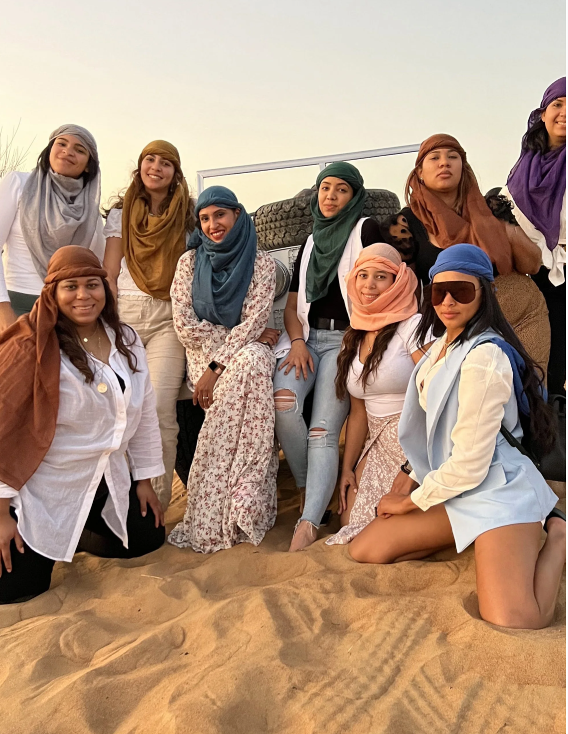 Hyak Travel group in the desert at sunset